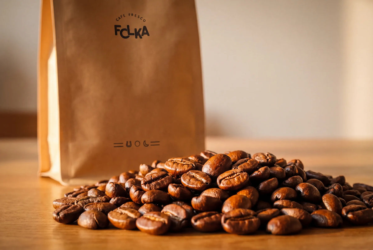Specialty roasted coffee beans with Folka bag and Mexican landscape backdrop